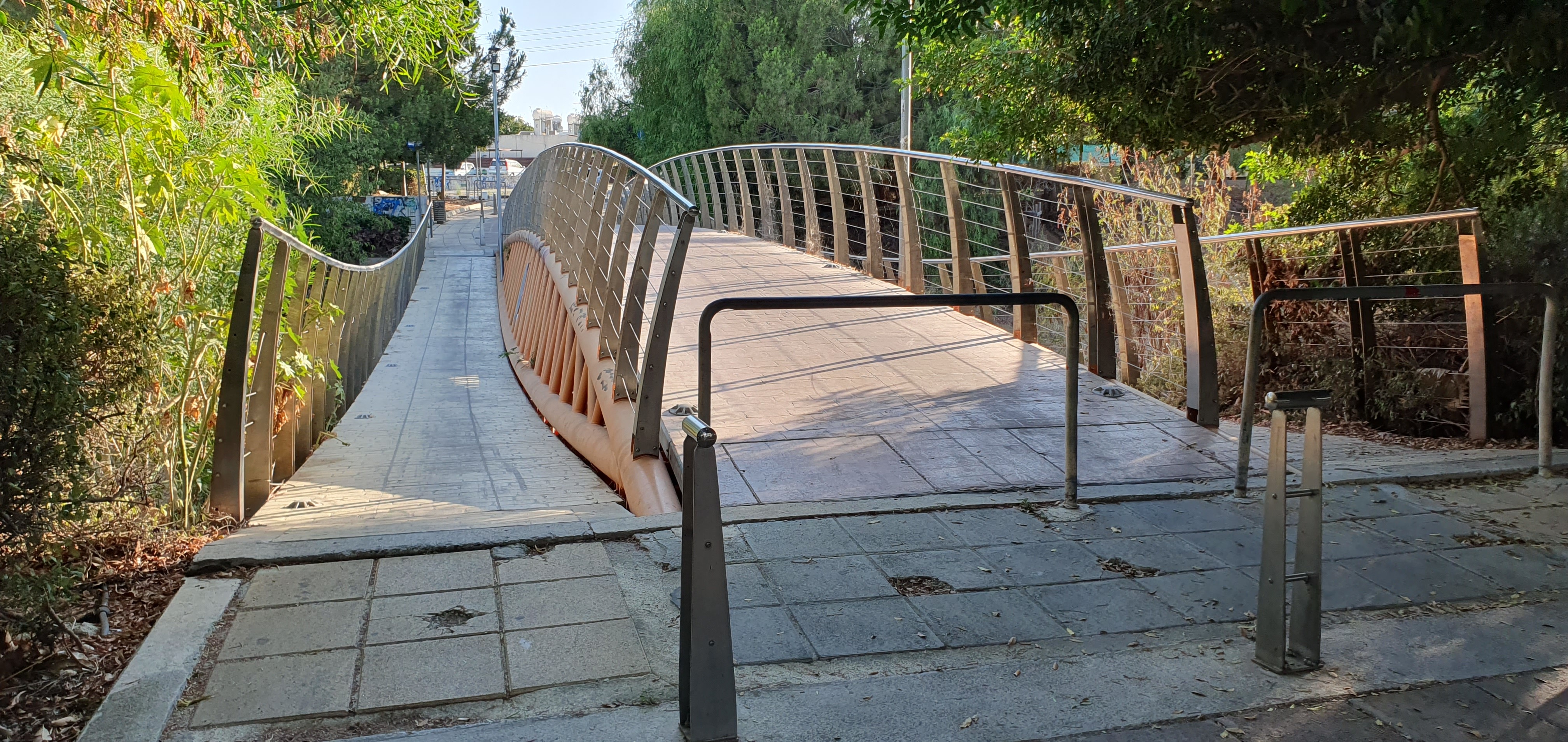 Missing barriers on the footbridge motorbikes cross the bridge constantly