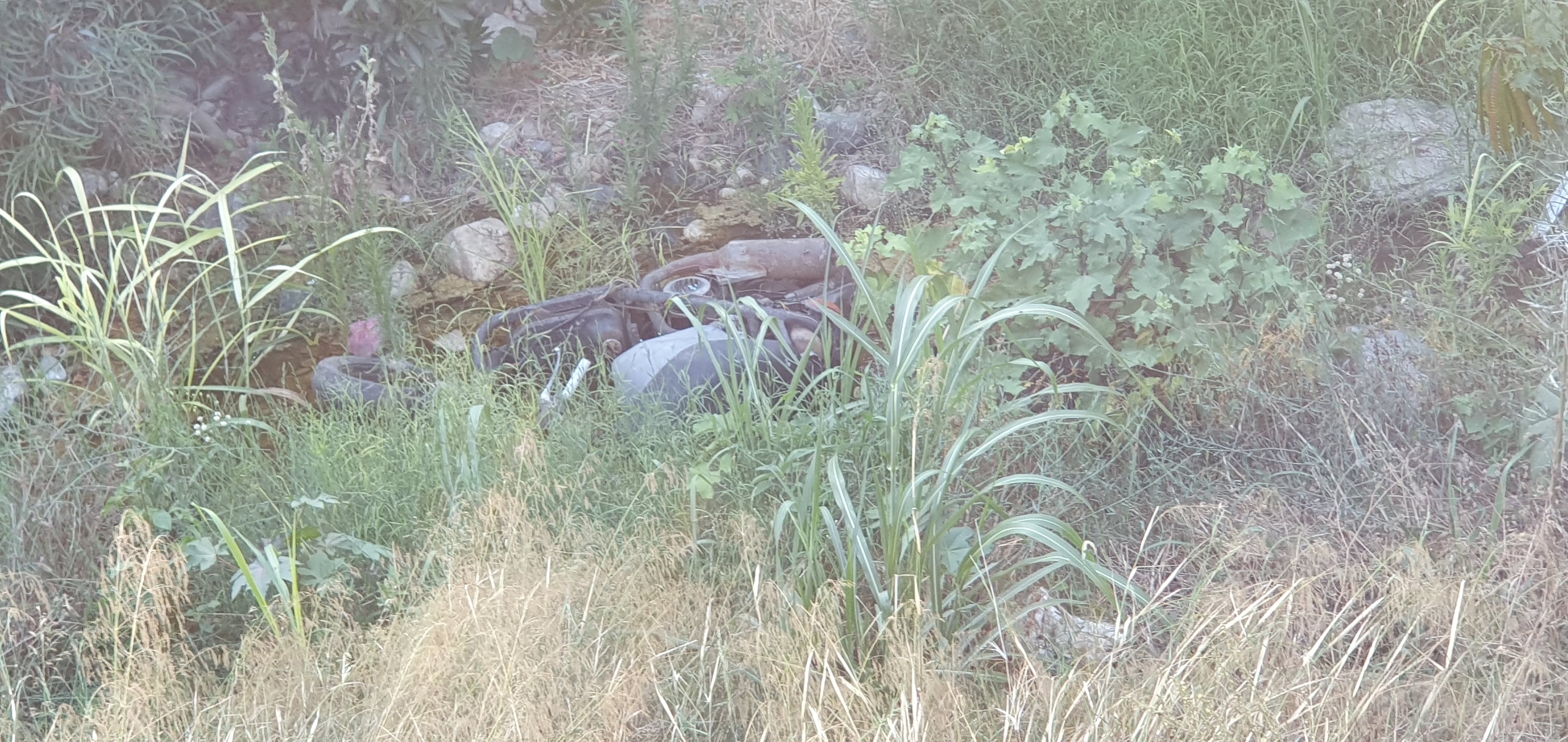 Dumped motorbike in the river
