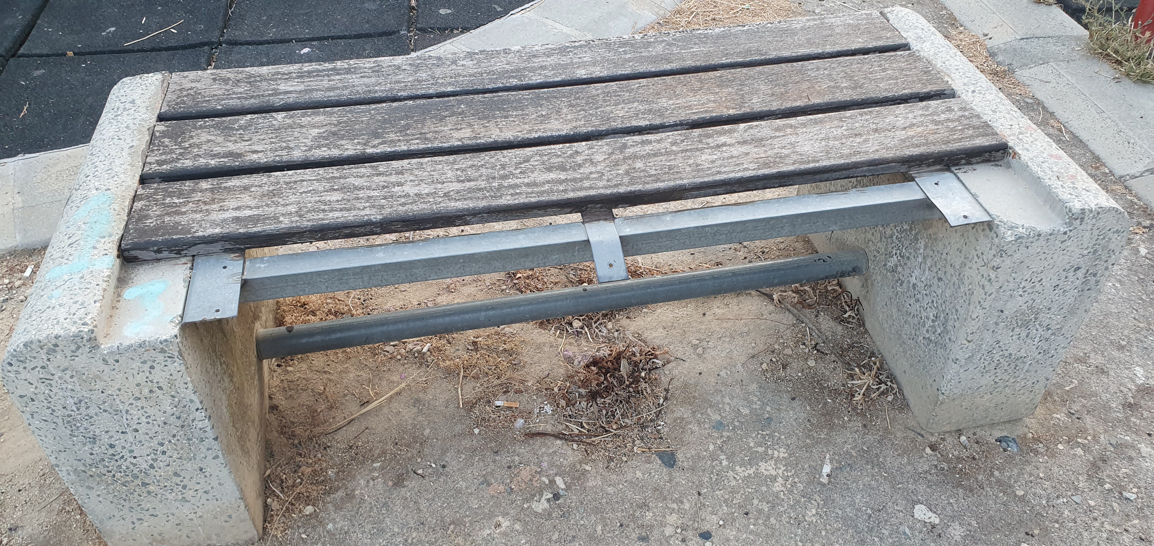 Broken and dangerous bench in childrens' playground