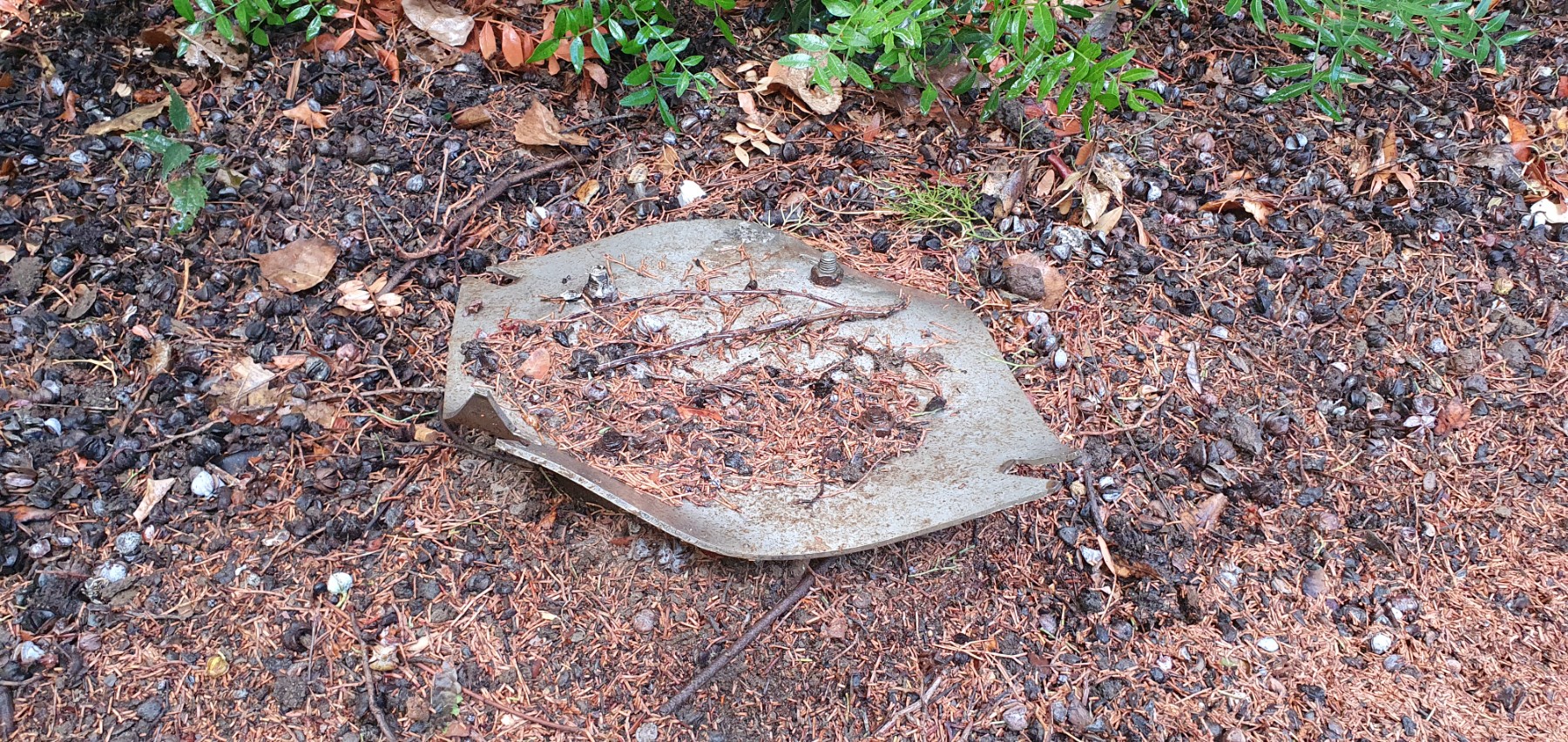 Rubbish bin has been removed. Dangerous base remains.